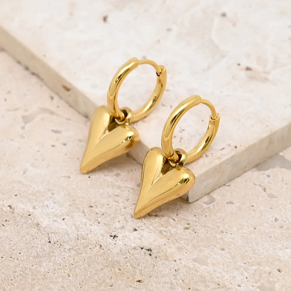 Gouden oorringen met hart hanger